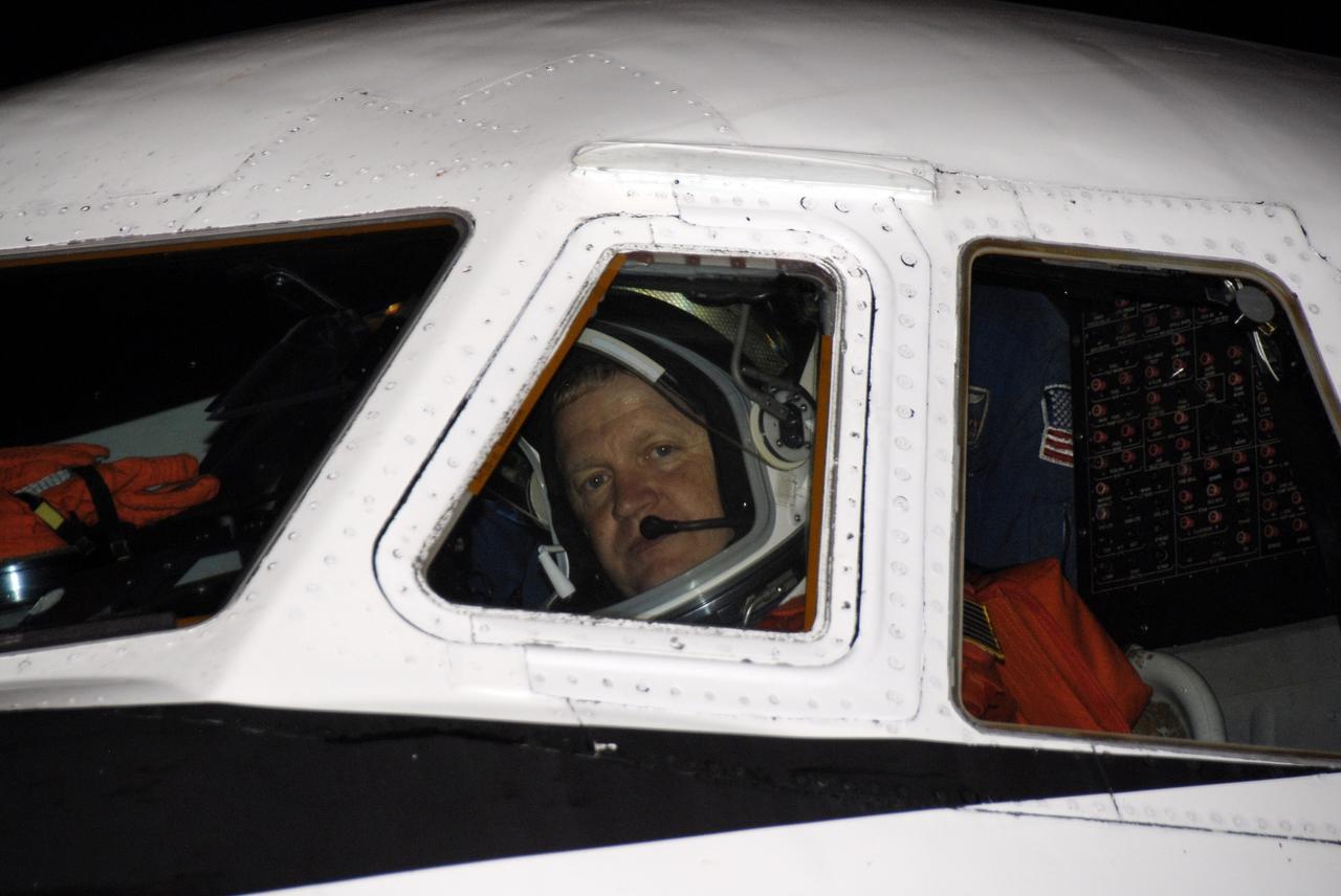 CAPE CANAVERAL, Fla. -   At the Shuttle Landing Facility at NASA's Kennedy Space Center in Florida, STS-126 Pilot Eric Boe peers out the cockpit window of the Shuttle Training Aircraft, or STA, before taking off to practice shuttle landings.  The STA is a Grumman American Aviation-built Gulf Stream II jet that was modified to simulate a shuttle’s cockpit, motion and visual cues, and handling qualities. In flight, the aircraft duplicates the shuttle’s atmospheric descent trajectory from approximately 35,000 feet to landing. The practice is part of the Terminal Countdown Demonstration Test, which includes equipment familiarization, emergency exit procedures and a simulated launch countdown.  On the STS-126 mission, space shuttle Endeavour's crew will deliver equipment and supplies to the International Space Station in preparation for expansion from a three- to six-person resident crew aboard the complex. The mission also will include four spacewalks to service the station’s Solar Alpha Rotary Joints. Endeavour is targeted to launch Nov. 14. Photo credit: NASA/Kim Shiflett