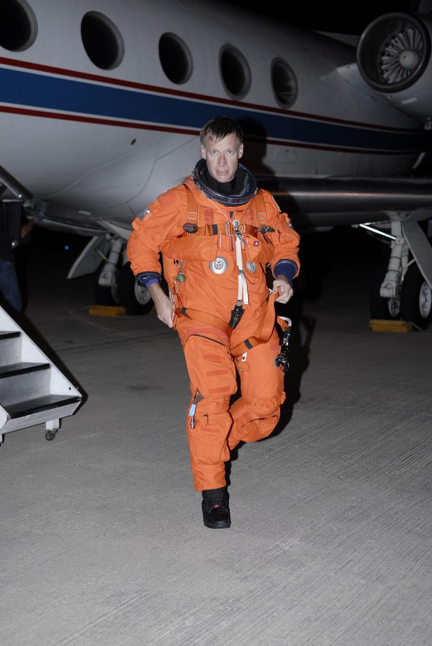 CAPE CANAVERAL, Fla. - At NASA's Kennedy Space Center in Florida, STS-126 Commander Chris Ferguson walks away from the Shuttle Training Aircraft, or STA, after practicing shuttle landings. The STA is a Grumman American Aviation-built Gulf Stream II jet that was modified to simulate a shuttle’s cockpit, motion and visual cues, and handling qualities. In flight, the aircraft duplicates the shuttle’s atmospheric descent trajectory from approximately 35,000 feet to landing. The practice is part of the Terminal Countdown Demonstration Test, which includes equipment familiarization, emergency exit procedures and a simulated launch countdown. On the STS-126 mission, space shuttle Endeavour's crew will deliver equipment and supplies to the International Space Station in preparation for expansion from a three- to six-person resident crew aboard the complex. The mission also will include four spacewalks to service the station’s Solar Alpha Rotary Joints. Endeavour is targeted to launch Nov. 14. Photo credit: NASA/Kim Shiflett
