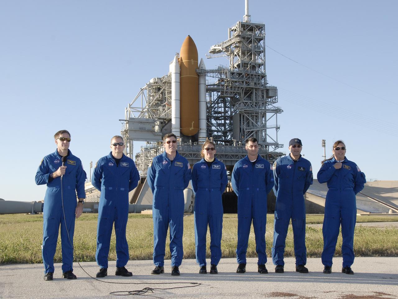 CAPE CANAVERAL, Fla. -   On Launch Pad 39A at NASA's Kennedy Space Center in Florida, the STS-126 crew is ready to answer questions from the media about their mission.  Commander Chris Ferguson, at left, introduces his crew: (from left) Pilot Eric Boe and Mission Specialists Steve Bowen, Sandra Magnus, Shane Kimbrough, Donald Pettit and Heidemarie Stefanyshyn-Piper. Behind them is space shuttle Endeavour. The crew is at Kennedy to take part in the Terminal Countdown Demonstration Test, which includes equipment familiarization, emergency exit procedures and a simulated launch countdown.  On the STS-126 mission, space shuttle Endeavour's crew will deliver equipment and supplies to the International Space Station in preparation for expansion from a three- to six-person resident crew aboard the complex. The mission also will include four spacewalks to service the station’s Solar Alpha Rotary Joints. Endeavour is targeted to launch Nov. 14.  Photo credit: NASA/Kim Shiflett