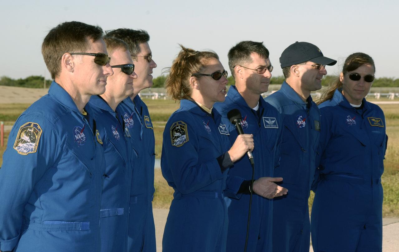 CAPE CANAVERAL, Fla. -   On Launch Pad 39A at NASA's Kennedy Space Center in Florida, STS-126 Mission Specialist Sandra Magnus (with microphone) answers a question from the media.  The other crew members with her are (from left) Commander Chris Ferguson, Pilot Eric Boe and Mission Specialists Steve Bowen, Shane Kimbrough, Donald Pettit and Heidemarie Stefanyshyn-Piper. The crew is at Kennedy to take part in the Terminal Countdown Demonstration Test, which includes equipment familiarization, emergency exit procedures and a simulated launch countdown.  On the STS-126 mission, space shuttle Endeavour's crew will deliver equipment and supplies to the International Space Station in preparation for expansion from a three- to six-person resident crew aboard the complex. The mission also will include four spacewalks to service the station’s Solar Alpha Rotary Joints. Endeavour is targeted to launch Nov. 14.  Photo credit: NASA/Kim Shiflett