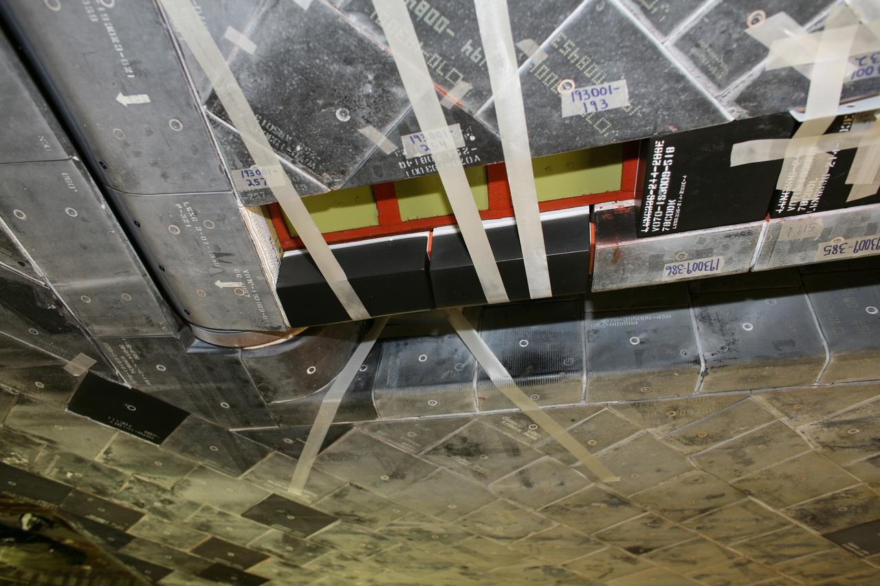 CAPE CANAVERAL, Fla. – A closeup of hub tiles replaced on space shuttle Discovery before its STS-119 mission targeted for Feb. 12. Hub tiles, heat protection tiles, are difficult to install because of their location on the inboard side of the inboard elevons. On the STS-119 mission, Discovery will carry the S6 truss segment to complete the 361-foot-long backbone of the International Space Station. The truss includes the fourth pair of solar array wings and electronics that convert sunlight to power for the orbiting laboratory. Photo credit: NASA/Dimitri Gerondidakis