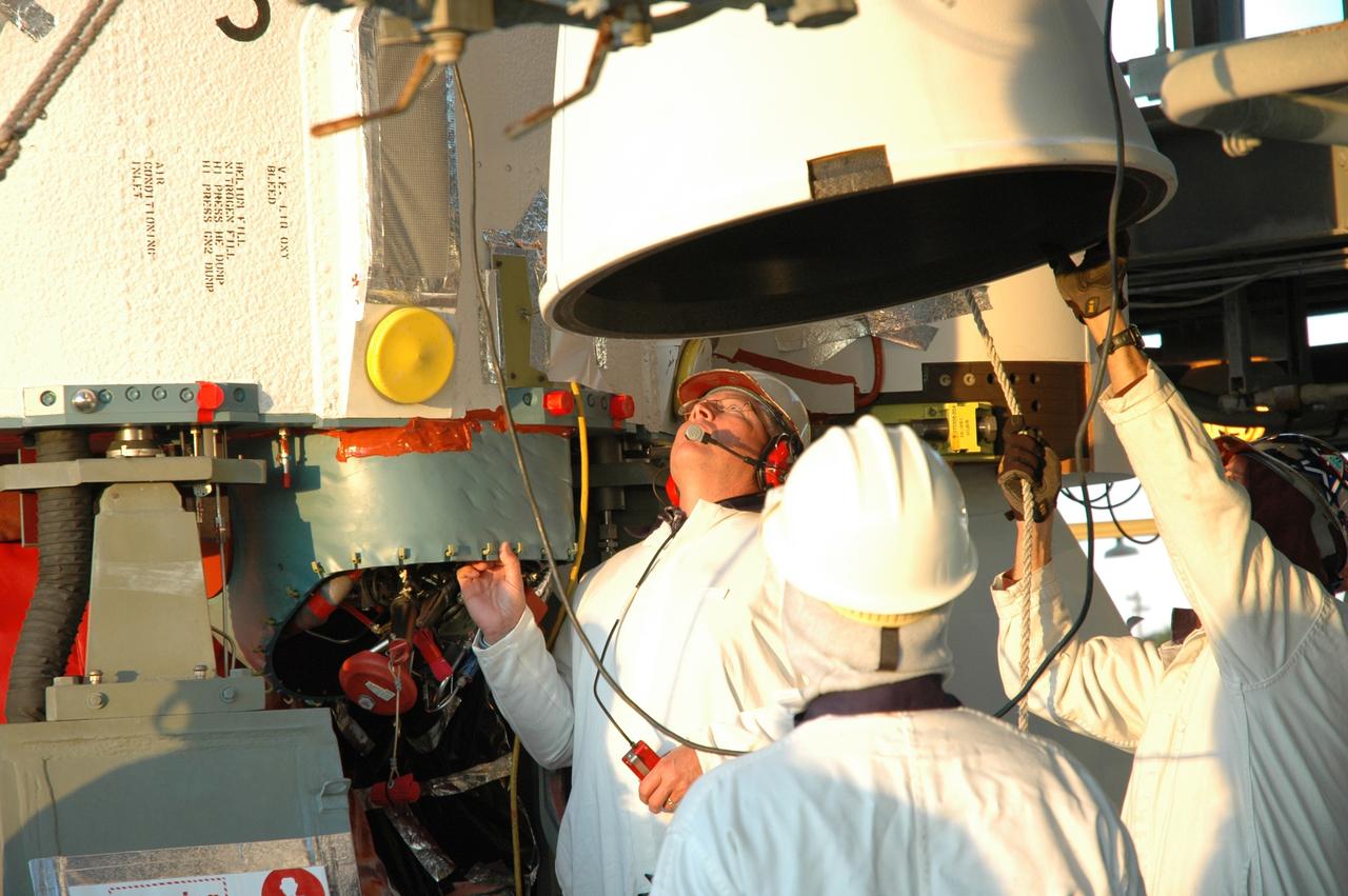 CAPE CANAVERAL, Fla. – On Launch Pad 17-B at Cape Canaveral Air Force Station in Florida, workers get ready to lift an air-lit strap-on solid rocket booster to be mated onto the Delta 2 launch vehicle that will carry the Kepler spacecraft into orbit. The Kepler mission is specifically designed to survey our region of the Milky Way galaxy to discover hundreds of Earth-size and smaller planets in or near the habitable zone and determine how many of the billions of stars in our galaxy have such planets. Results from this mission will allow us to place our solar system within the continuum of planetary systems in the Galaxy. NASA's planet-hunting Kepler mission is scheduled to launch no earlier than March 5, 2009. Photo credit: NASA/Jim Grossmann