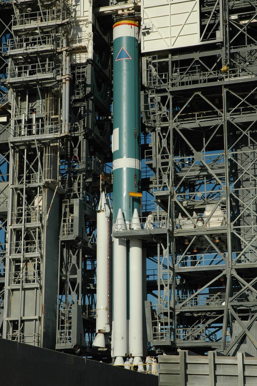 CAPE CANAVERAL, Fla. – On Launch Pad 17-B at Cape Canaveral Air Force Station in Florida, air-lit strap-on solid rocket boosters are being added to the first stage of the Delta 2 launch vehicle (seen here) that will carry the Kepler spacecraft into orbit. The Kepler mission is specifically designed to survey our region of the Milky Way galaxy to discover hundreds of Earth-size and smaller planets in or near the habitable zone and determine how many of the billions of stars in our galaxy have such planets. Results from this mission will allow us to place our solar system within the continuum of planetary systems in the Galaxy. NASA's planet-hunting Kepler mission is scheduled to launch no earlier than March 5, 2009. Photo credit: NASA/Jim Grossmann