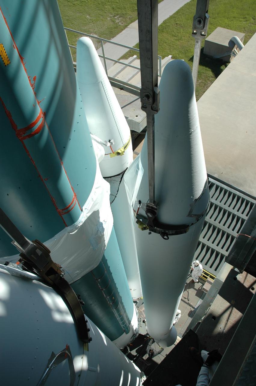 CAPE CANAVERAL, Fla. – On Launch Pad 17-B at Cape Canaveral Air Force Station in Florida, a view from an upper level of the launch tower show air-lit strap-on solid rocket boosters being added to the first stage of the Delta 2 launch vehicle that will carry the Kepler spacecraft into orbit. The Kepler mission is specifically designed to survey our region of the Milky Way galaxy to discover hundreds of Earth-size and smaller planets in or near the habitable zone and determine how many of the billions of stars in our galaxy have such planets. Results from this mission will allow us to place our solar system within the continuum of planetary systems in the Galaxy. NASA's planet-hunting Kepler mission is scheduled to launch no earlier than March 5, 2009. Photo credit: NASA/Jim Grossmann