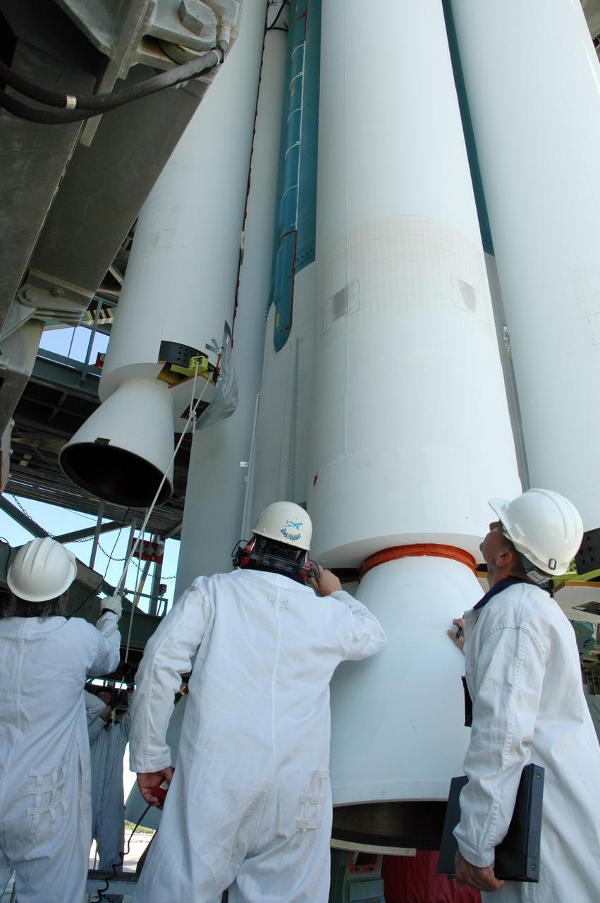 CAPE CANAVERAL, Fla. – On Launch Pad 17-B at Cape Canaveral Air Force Station in Florida, workers oversee the lifting of an air-lit strap-on solid rocket booster that will be mated to the Delta 2 launch vehicle that will carry the Kepler spacecraft into orbit. The Kepler mission is specifically designed to survey our region of the Milky Way galaxy to discover hundreds of Earth-size and smaller planets in or near the habitable zone and determine how many of the billions of stars in our galaxy have such planets. Results from this mission will allow us to place our solar system within the continuum of planetary systems in the Galaxy. NASA's planet-hunting Kepler mission is scheduled to launch no earlier than March 5, 2009. Photo credit: NASA/Jim Grossmann