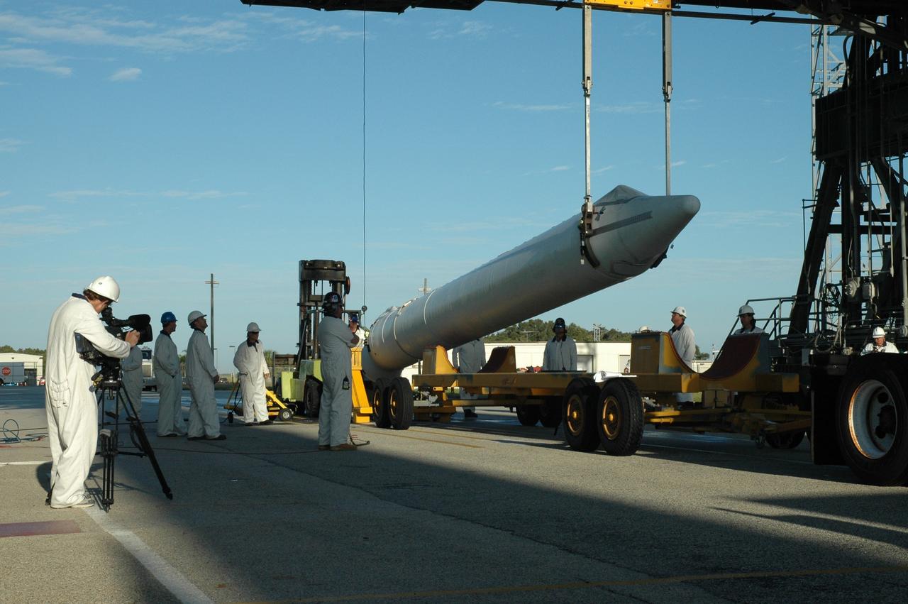 CAPE CANAVERAL, Fla. – On Launch Pad 17-B at Cape Canaveral Air Force Station in Florida, a solid rocket booster is raised off its transporter. It will be raised to vertical and lifted into the mobile service tower for mating to the first stage of the Kepler's Delta 2 launch vehicle. The Kepler mission is specifically designed to survey our region of the Milky Way galaxy to discover hundreds of Earth-size and smaller planets in or near the habitable zone and determine how many of the billions of stars in our galaxy have such planets. Results from this mission will allow us to place our solar system within the continuum of planetary systems in the Galaxy. NASA's planet-hunting Kepler mission is scheduled to launch no earlier than March 5, 2009. Photo credit: NASA/Jim Grossmann