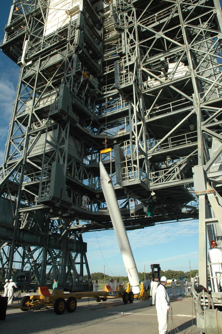 CAPE CANAVERAL, Fla. – On Launch Pad 17-B at Cape Canaveral Air Force Station in Florida, a solid rocket booster is nearly vertical. It will be lifted into the mobile service tower for mating to the first stage of the Kepler's Delta 2 launch vehicle. The Kepler mission is specifically designed to survey our region of the Milky Way galaxy to discover hundreds of Earth-size and smaller planets in or near the habitable zone and determine how many of the billions of stars in our galaxy have such planets. Results from this mission will allow us to place our solar system within the continuum of planetary systems in the Galaxy. NASA's planet-hunting Kepler mission is scheduled to launch no earlier than March 5, 2009. Photo credit: NASA/Jim Grossmann