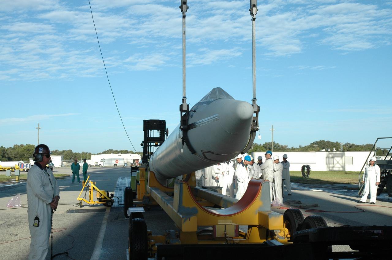 CAPE CANAVERAL, Fla. – On Launch Pad 17-B at Cape Canaveral Air Force Station in Florida, another solid rocket booster is raised off its transporter. It will be raised to vertical and lifted into the mobile service tower for mating to the first stage of the Kepler's Delta 2 launch vehicle. The Kepler mission is specifically designed to survey our region of the Milky Way galaxy to discover hundreds of Earth-size and smaller planets in or near the habitable zone and determine how many of the billions of stars in our galaxy have such planets. Results from this mission will allow us to place our solar system within the continuum of planetary systems in the Galaxy. NASA's planet-hunting Kepler mission is scheduled to launch no earlier than March 5, 2009. Photo credit: NASA/Jim Grossmann