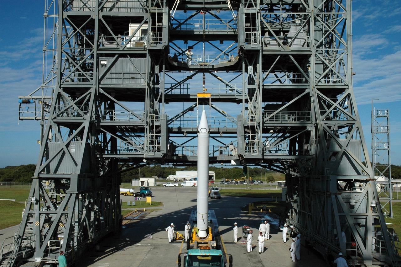 CAPE CANAVERAL, Fla. – On Launch Pad 17-B at Cape Canaveral Air Force Station in Florida, another solid rocket booster is raised to vertical. It will be lifted into the mobile service tower for mating to the first stage of the Kepler's Delta 2 launch vehicle. The Kepler mission is specifically designed to survey our region of the Milky Way galaxy to discover hundreds of Earth-size and smaller planets in or near the habitable zone and determine how many of the billions of stars in our galaxy have such planets. Results from this mission will allow us to place our solar system within the continuum of planetary systems in the Galaxy. NASA's planet-hunting Kepler mission is scheduled to launch no earlier than March 5, 2009. Photo credit: NASA/Jim Grossmann