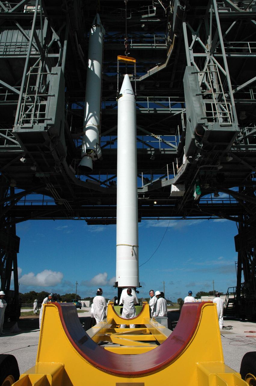 CAPE CANAVERAL, Fla. – On Launch Pad 17-B at Cape Canaveral Air Force Station in Florida, another solid rocket booster is being lifted into the mobile service tower for mating to the first stage of the Kepler's Delta 2 launch vehicle. The Kepler mission is specifically designed to survey our region of the Milky Way galaxy to discover hundreds of Earth-size and smaller planets in or near the habitable zone and determine how many of the billions of stars in our galaxy have such planets. Results from this mission will allow us to place our solar system within the continuum of planetary systems in the Galaxy. NASA's planet-hunting Kepler mission is scheduled to launch no earlier than March 5, 2009. Photo credit: NASA/Jim Grossmann