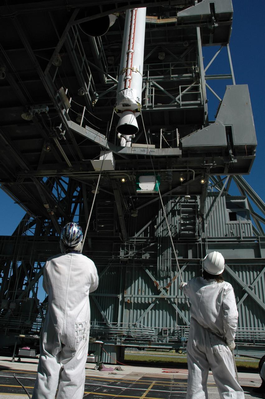 CAPE CANAVERAL, Fla. – On Launch Pad 17-B at Cape Canaveral Air Force Station in Florida, another solid rocket booster is being lifted into the mobile service tower for mating to the first stage of the Kepler's Delta 2 launch vehicle. The Kepler mission is specifically designed to survey our region of the Milky Way galaxy to discover hundreds of Earth-size and smaller planets in or near the habitable zone and determine how many of the billions of stars in our galaxy have such planets. Results from this mission will allow us to place our solar system within the continuum of planetary systems in the Galaxy. NASA's planet-hunting Kepler mission is scheduled to launch no earlier than March 5, 2009. Photo credit: NASA/Jim Grossmann