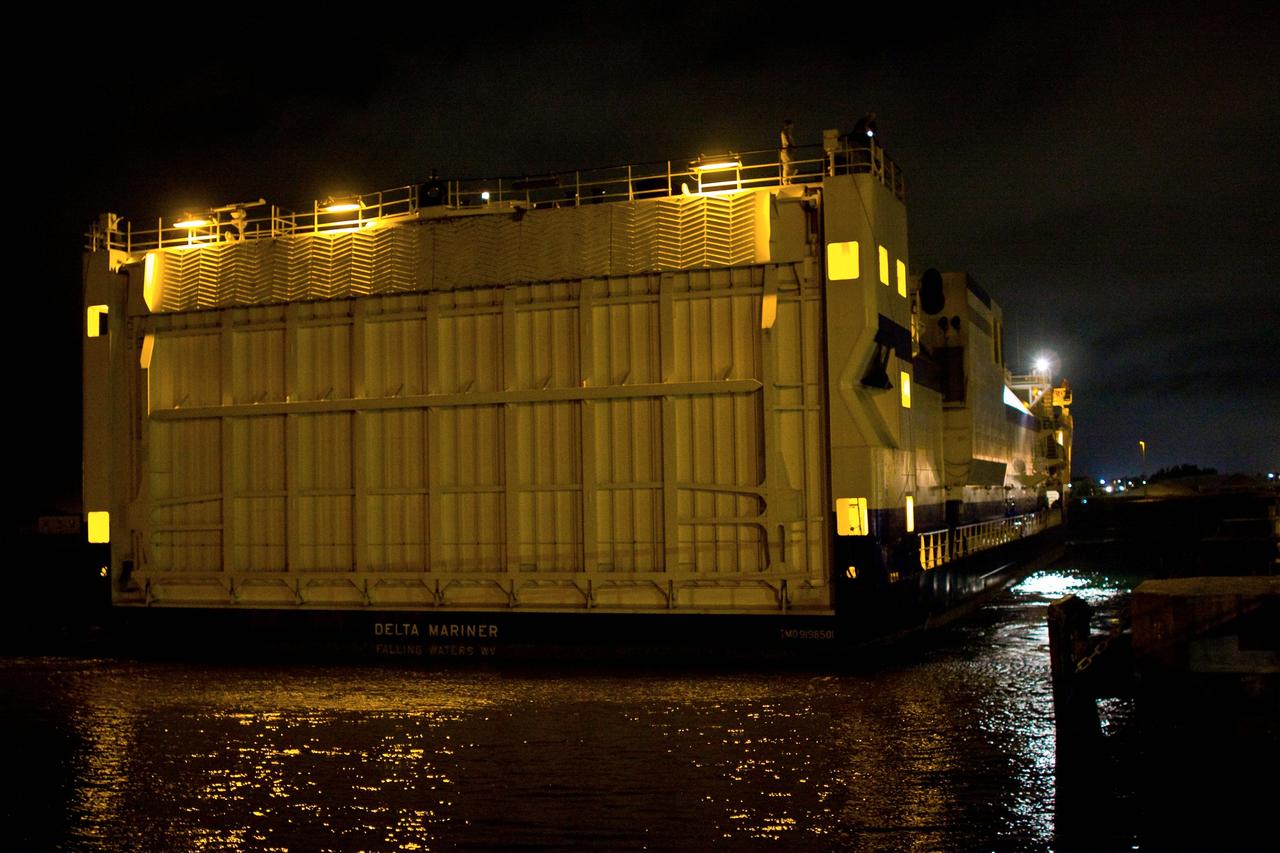 CAPE CANAVERAL, Fla. – The Delta Mariner arrives at Port Canaveral, Fla., with its cargo of the Ares I-X upper stage simulator segments. The upper stage simulator will be used in the test flight identified as Ares I-X in 2009. The segments will simulate the mass and the outer mold line and will be more than 100 feet of the total vehicle height of 327 feet. The simulator comprises 11 segments that are approximately 18 feet in diameter. Most of the segments will be approximately 10 feet high, ranging in weight from 18,000 to 60,000 pounds, for a total of approximately 450,000 pounds. Photo credit: NASA/Dimitri Gerondidakis