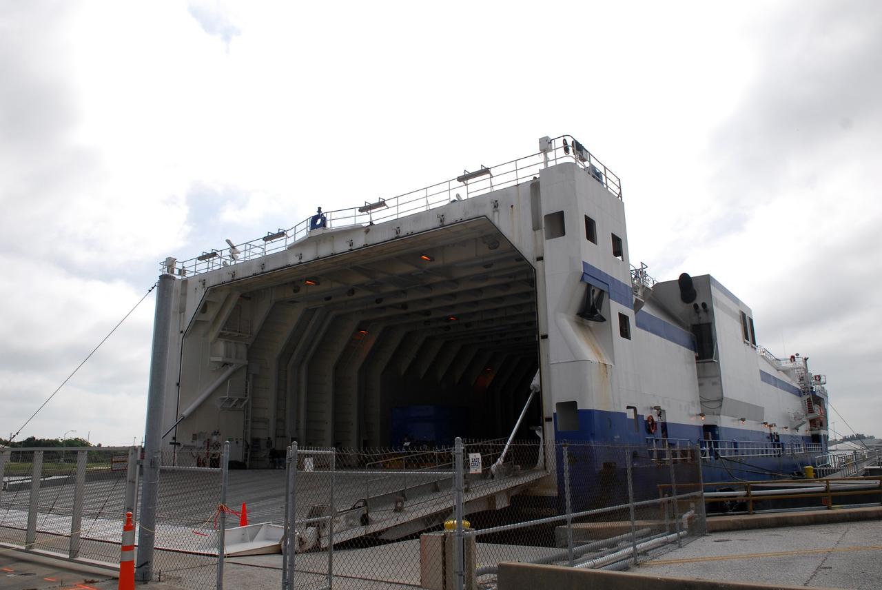 CAPE CANAVERAL, Fla. –  The Delta Mariner docks at Port Canaveral, Fla., with its cargo of the Ares I-X upper stage simulator segments. The upper stage simulator will be used in the test flight identified as Ares I-X in 2009.  The segments will simulate the mass and the outer mold line and will be more than 100 feet of the total vehicle height of 327 feet.  The simulator comprises 11 segments that are approximately 18 feet in diameter.  Most of the segments will be approximately 10 feet high, ranging in weight from 18,000 to 60,000 pounds, for a total of approximately 450,000 pounds.  Photo credit: NASA/Dimitri Gerondidakis