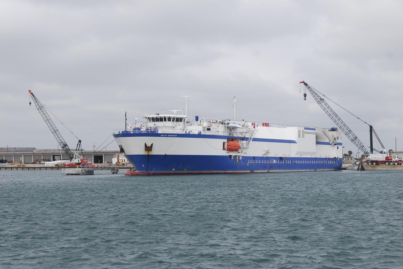 CAPE CANAVERAL, Fla. – The Delta Mariner is docked at Port Canaveral, Fla., with its cargo of the Ares I-X upper stage simulator segments. The cranes near the ship will be used to remove the segments and place them on a flatbed truck for transportation to the Vehicle Assembly Building's high bay 4 at NASA's Kennedy Space Center in Florida. The upper stage simulator will be used in the test flight identified as Ares I-X in 2009. The segments will simulate the mass and the outer mold line and will be more than 100 feet of the total vehicle height of 327 feet. The simulator comprises 11 segments that are approximately 18 feet in diameter. Most of the segments will be approximately 10 feet high, ranging in weight from 18,000 to 60,000 pounds, for a total of approximately 450,000 pounds. Photo credit: NASA/Dimitri Gerondidakis