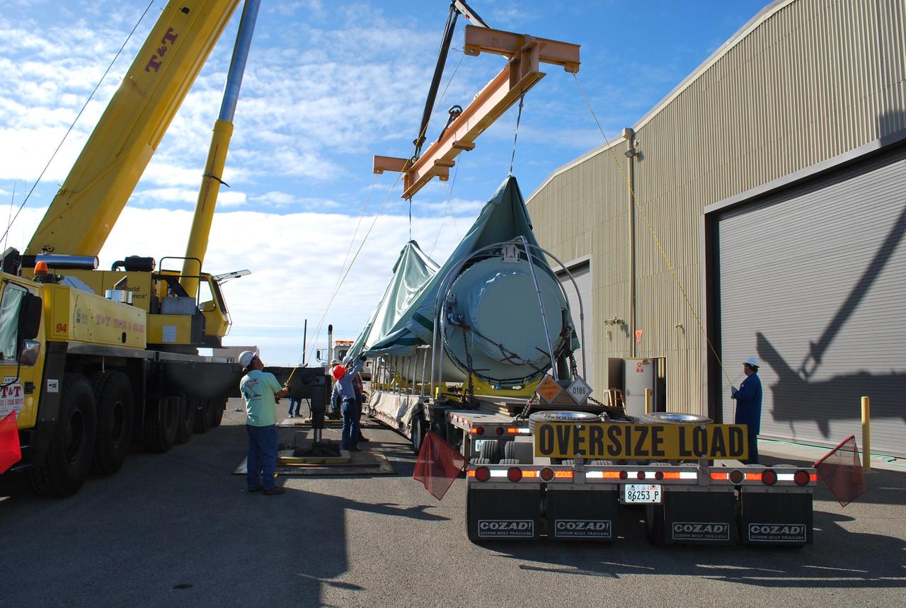 VANDENBERG AIR FORCE BASE, Calif. – After arrival of the Stage 0 motor for the Taurus XL launch vehicle at Vandenberg Air Force Base in California, a crane lifts off the protective shipping cover.  The motor will be transported to Orbital Sciences' Hangar 1555. The Taurus XL will launch NASA's Orbiting Carbon Observatory, or OCO, spacecraft targeted for Jan. 15.  The OCO is a new Earth-orbiting mission sponsored by NASA's Earth System Science Pathfinder Program. Photo credit: NASA/Randy Beaudoin, VAFB