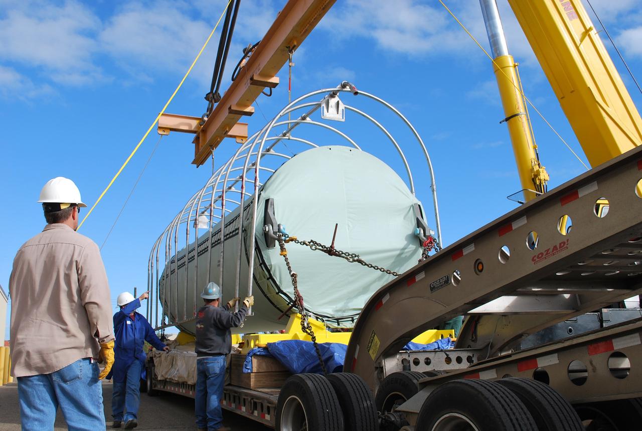 VANDENBERG AIR FORCE BASE, Calif. – After arrival of the Stage 0 motor for the Taurus XL launch vehicle at Vandenberg Air Force Base in California, a crane lifts off the protective cage.  The motor will be transported to Orbital Sciences' Hangar 1555. The Taurus XL will launch NASA's Orbiting Carbon Observatory, or OCO, spacecraft targeted for Jan. 15.  The OCO is a new Earth-orbiting mission sponsored by NASA's Earth System Science Pathfinder Program. Photo credit: NASA/Randy Beaudoin, VAFB