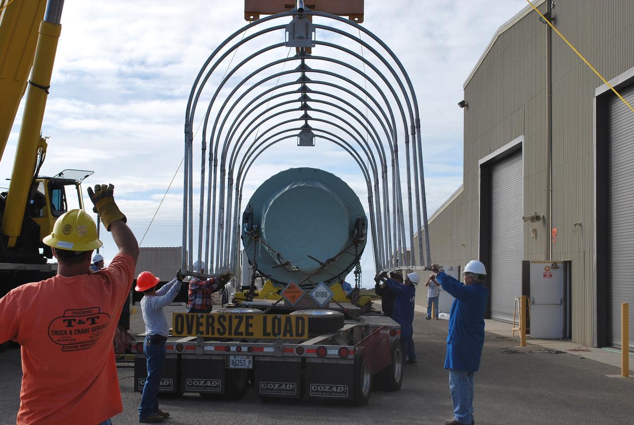 VANDENBERG AIR FORCE BASE, Calif. –  After arrival of the Stage 0 motor for the Taurus XL launch vehicle at Vandenberg Air Force Base in California, a crane lifts off the protective cage.  The motor will be transported to Orbital Sciences' Hangar 1555. The Taurus XL will launch NASA's Orbiting Carbon Observatory, or OCO, spacecraft targeted for Jan. 15.  The OCO is a new Earth-orbiting mission sponsored by NASA's Earth System Science Pathfinder Program. Photo credit: NASA/Randy Beaudoin, VAFB