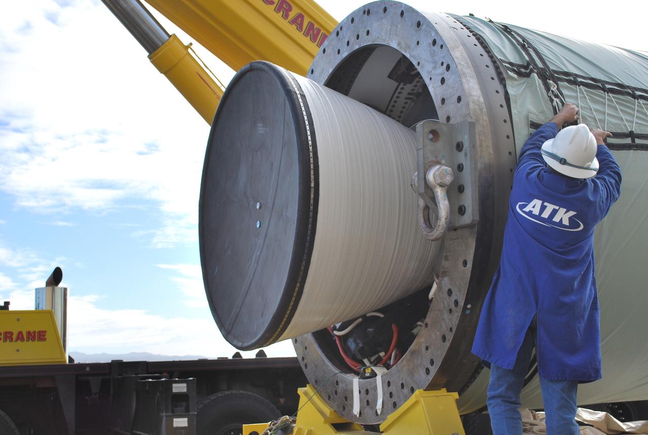 VANDENBERG AIR FORCE BASE, Calif. –   At Vandenberg Air Force Base in California, a worker secures a crane on the Taurus XL Stage 0 motor.  The motor will be lifted onto a flatbed truck and transported to Orbital Sciences' Hangar 1555. The Taurus XL will launch NASA's Orbiting Carbon Observatory, or OCO, spacecraft targeted for Jan. 15.  The OCO is a new Earth-orbiting mission sponsored by NASA's Earth System Science Pathfinder Program. Photo credit: NASA/Randy Beaudoin, VAFB