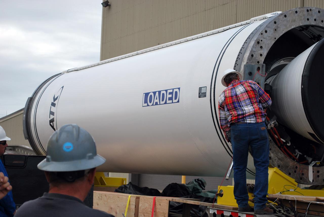 VANDENBERG AIR FORCE BASE, Calif. –   At Vandenberg Air Force Base in California, a worker secures a crane on the Taurus XL Stage 0 motor.  The motor will be lifted onto a flatbed truck and transported to Orbital Sciences' Hangar 1555. The Taurus XL will launch NASA's Orbiting Carbon Observatory, or OCO, spacecraft targeted for Jan. 15.  The OCO is a new Earth-orbiting mission sponsored by NASA's Earth System Science Pathfinder Program. Photo credit: NASA/Randy Beaudoin, VAFB