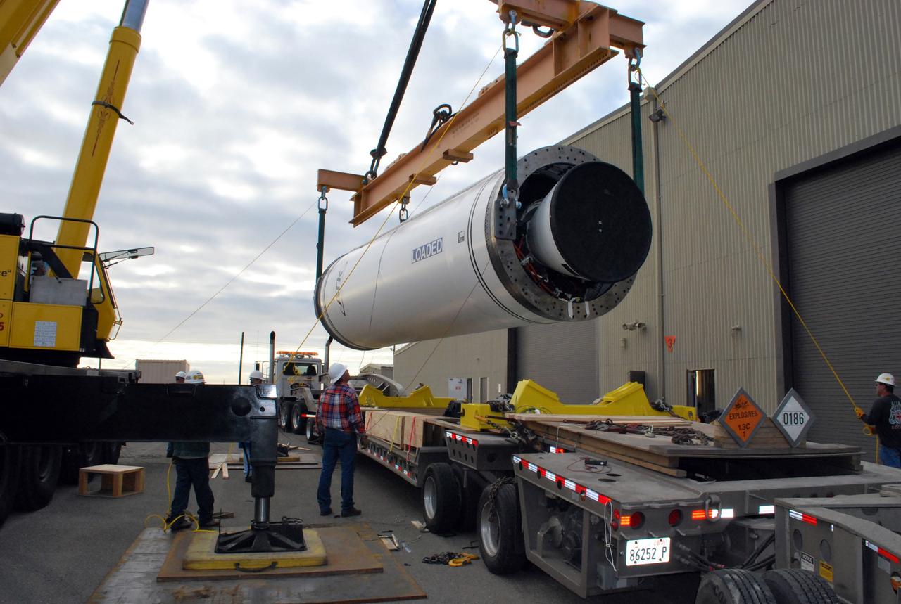 VANDENBERG AIR FORCE BASE, Calif. –   At Vandenberg Air Force Base in California, a crane lifts the Taurus XL Stage 0 motor to move it to a flatbed truck. The motor will be transported to Orbital Sciences' Hangar 1555. The Taurus XL will launch NASA's Orbiting Carbon Observatory, or OCO, spacecraft targeted for Jan. 15.  The OCO is a new Earth-orbiting mission sponsored by NASA's Earth System Science Pathfinder Program. Photo credit: NASA/Randy Beaudoin, VAFB