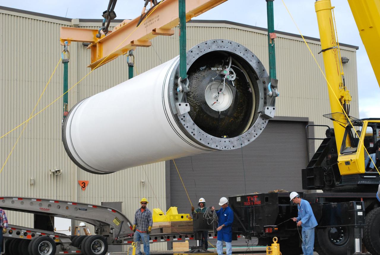 VANDENBERG AIR FORCE BASE, Calif. –   At Vandenberg Air Force Base in California, a crane lifts the Taurus XL Stage 0 motor to move it to a flatbed truck. The motor will be transported to Orbital Sciences' Hangar 1555. The Taurus XL will launch NASA's Orbiting Carbon Observatory, or OCO, spacecraft targeted for Jan. 15.  The OCO is a new Earth-orbiting mission sponsored by NASA's Earth System Science Pathfinder Program. Photo credit: NASA/Randy Beaudoin, VAFB
