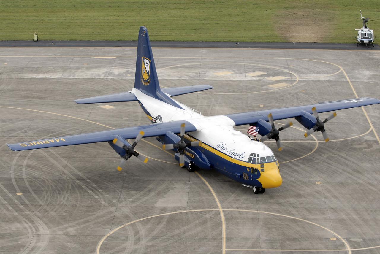 CAPE CANAVERAL, Fla. –  A C-130 airplane flown by U.S. Marines lands at the Shuttle Landing Facility at NASA's Kennedy Space Center in Florida.  The plane carries the support team for the U.S. Navy's Blue Angels, who are going to perform at the Kennedy Space Center Visitor Complex Space and Air Show Nov. 8-9.   The Navy's elite flight demonstration squadron will take to the skies in military aircraft demonstrations by the F-16 Fighting Falcon and F/A-18 Super Hornet jets for the second annual Space & Air Show at Kennedy. This year’s show brings together the best in military aircraft, coupled with precision pilots and veteran astronauts to celebrate spaceflight and aviation. The event includes military aircraft demonstrations by the F-16 Fighting Falcon and a water rescue demonstration by the 920th Rescue Wing. Photo credit: NASA/Kim Shiflett