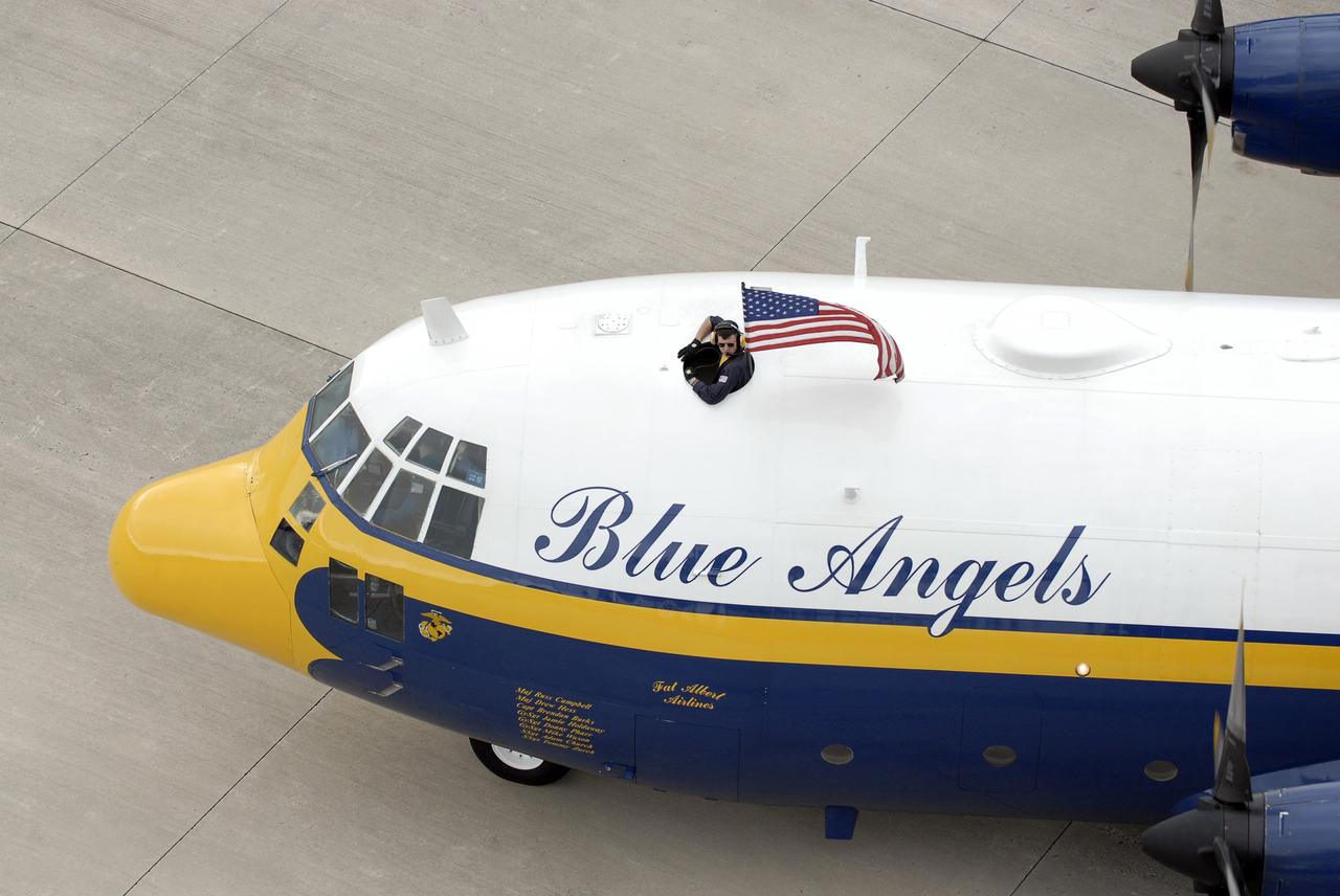 CAPE CANAVERAL, Fla. –  A C-130 airplane flown by U.S. Marines stops at the Shuttle Landing Facility at NASA's Kennedy Space Center in Florida.  The plane carries the support team for the U.S. Navy's Blue Angels, who are going to perform at the Kennedy Space Center Visitor Complex Space and Air Show Nov. 8-9.  The Navy's elite flight demonstration squadron will take to the skies in military aircraft demonstrations by the F-16 Fighting Falcon and F/A-18 Super Hornet jets for the second annual Space & Air Show at Kennedy. This year’s show brings together the best in military aircraft, coupled with precision pilots and veteran astronauts to celebrate spaceflight and aviation. The event includes military aircraft demonstrations by the F-16 Fighting Falcon and a water rescue demonstration by the 920th Rescue Wing. Photo credit: NASA/Kim Shiflett