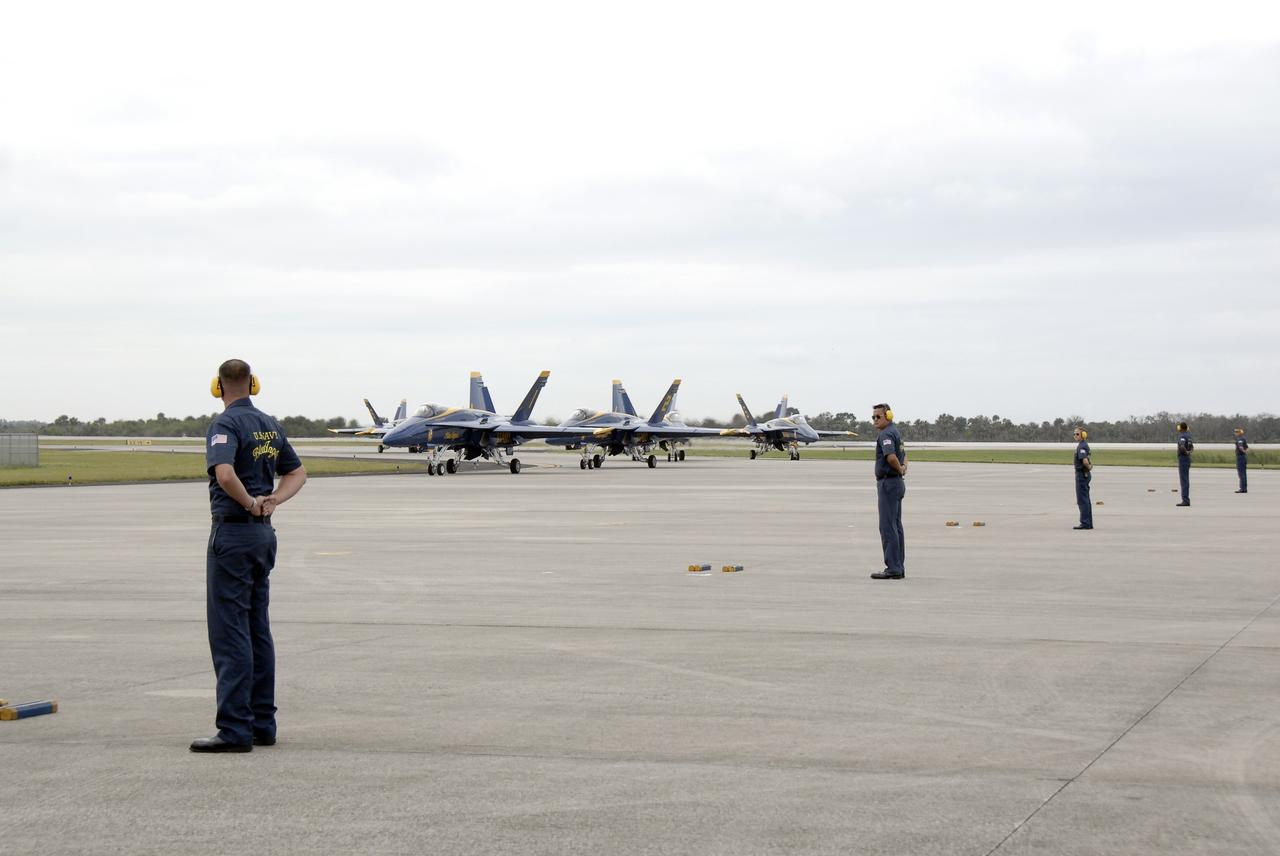 CAPE CANAVERAL, Fla. –  The U.S. Navy's Blue Angels demonstration squadron lands at the Shuttle Landing Facility at NASA's Kennedy Space Center in Florida.  They will perform at the Kennedy Space Center Visitor Complex Space and Air Show Nov. 8-9.  The Navy's elite flight demonstration squadron will take to the skies in military aircraft demonstrations by the F-16 Fighting Falcon and F/A-18 Super Hornet jets for the second annual Space & Air Show at Kennedy. This year’s show brings together the best in military aircraft, coupled with precision pilots and veteran astronauts to celebrate spaceflight and aviation. The event includes military aircraft demonstrations by the F-16 Fighting Falcon and a water rescue demonstration by the 920th Rescue Wing. Photo credit: NASA/Kim Shiflett