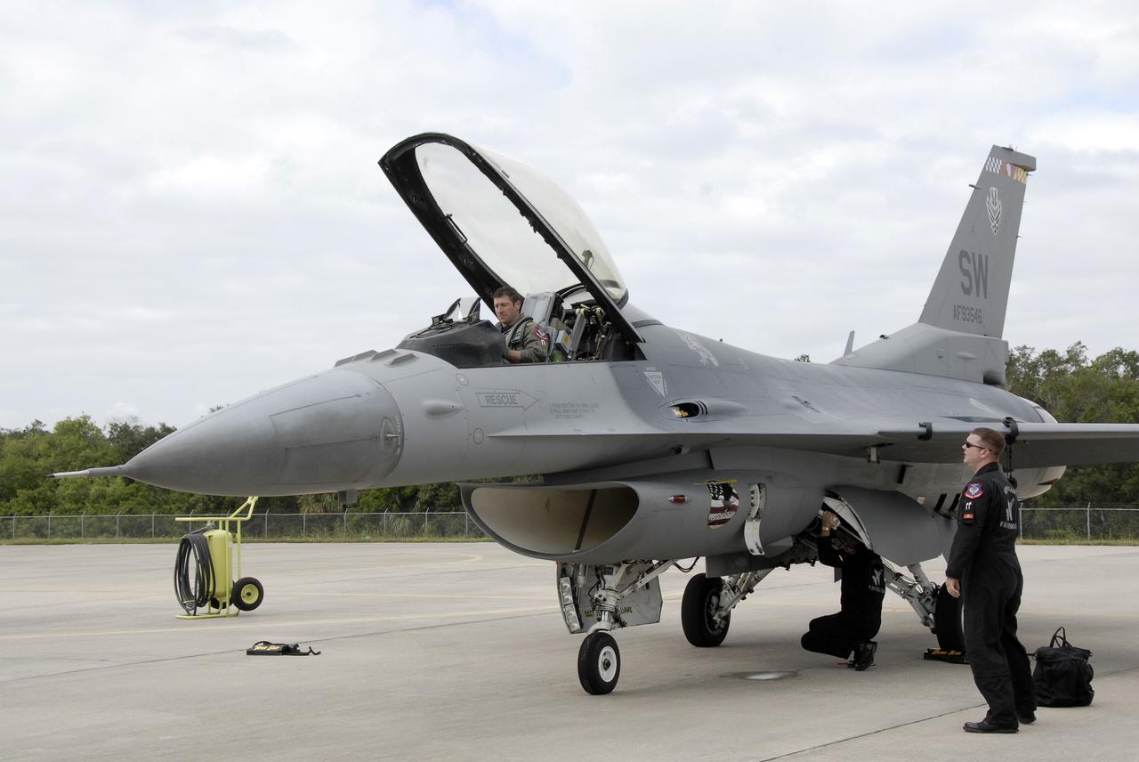 CAPE CANAVERAL, Fla. –  A pilot with the 920th Rescue Wing gets ready to disembark his plane after landing at NASA's Kennedy Space Center in Florida.  The Rescue Wing will join the U.S. Navy's Blue Angels for the Space and Air Show Nov. 8-9 at the Kennedy Space Center Visitor Complex. The Navy's elite flight demonstration squadron will take to the skies in military aircraft demonstrations by the F-16 Fighting Falcon and F/A-18 Super Hornet jets for the second annual Space & Air Show at Kennedy. This year’s show brings together the best in military aircraft, coupled with precision pilots and veteran astronauts to celebrate spaceflight and aviation. The event includes military aircraft demonstrations by the F-16 Fighting Falcon and a water rescue demonstration by the 920th Rescue Wing. Photo credit: NASA/Kim Shiflett