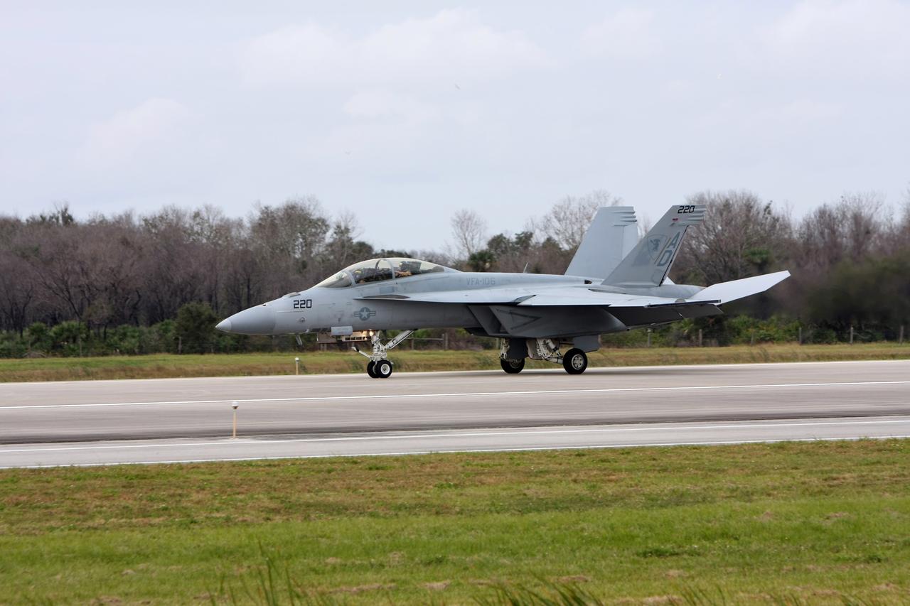CAPE CANAVERAL, Fla. – An F/A-18 jet lands at NASA's Kennedy Space Center in Florida.  It will join the U.S. Navy's Blue Angels and other aircraft for demonstrations at the Kennedy Space Center Visitor Complex Space and Air Show Nov. 8-9. The Navy's elite flight demonstration squadron will take to the skies in military aircraft demonstrations by the F-16 Fighting Falcon and F/A-18 Super Hornet jets for the second annual Space & Air Show at Kennedy. This year’s show brings together the best in military aircraft, coupled with precision pilots and veteran astronauts to celebrate spaceflight and aviation. The event includes military aircraft demonstrations by the F-16 Fighting Falcon and a water rescue demonstration by the 920th Rescue Wing. Photo credit: NASA/Kim Shiflett