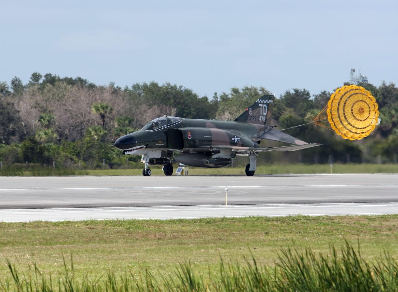 CAPE CANAVERAL, Fla. – An F-4 jet aircraft lands at NASA's Kennedy Space Center in Florida.  It will join the U.S. Navy's Blue Angels and other aircraft for demonstrations at the Kennedy Space Center Visitor Complex Space and Air Show Nov. 8-9. The Navy's elite flight demonstration squadron will take to the skies in military aircraft demonstrations by the F-16 Fighting Falcon and F/A-18 Super Hornet jets for the second annual Space & Air Show at Kennedy. This year’s show brings together the best in military aircraft, coupled with precision pilots and veteran astronauts to celebrate spaceflight and aviation. The event includes military aircraft demonstrations by the F-16 Fighting Falcon and a water rescue demonstration by the 920th Rescue Wing. Photo credit: NASA/Kim Shiflett