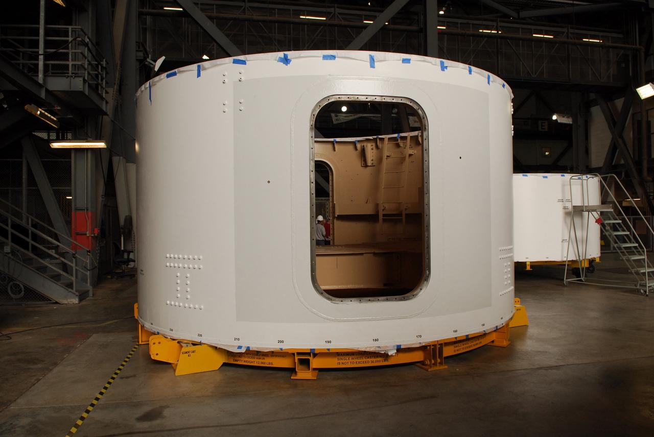 CAPE CANAVERAL, Fla. – Inside the Vehicle Assembly Building high bay 4 at NASA's Kennedy Space Center in Florida, these Ares I-X upper stage simulator segments have shed their protective blue shrink-wrapped covers used for shipping. The upper stage simulator will be used in the test flight identified as Ares I-X in 2009. The segments will simulate the mass and the outer mold line and will be more than 100 feet of the total vehicle height of 327 feet. The simulator comprises 11 segments that are approximately 18 feet in diameter. Most of the segments will be approximately 10 feet high, ranging in weight from 18,000 to 60,000 pounds, for a total of approximately 450,000 pounds. Photo credit: NASA/Troy Cryder