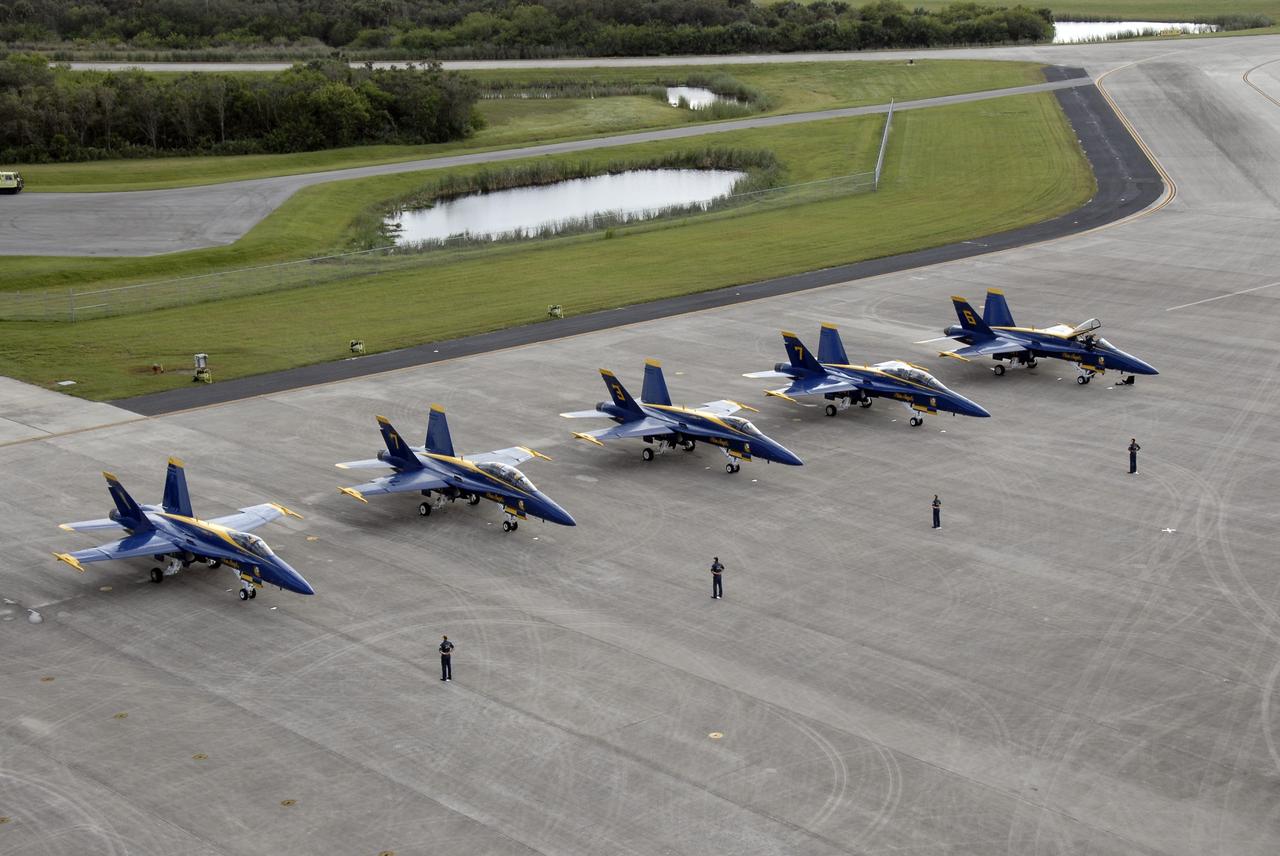 CAPE CANAVERAL, Fla. – The U.S. Navy's F/A-18 Blue Angels are lined up on the Shuttle Landing Facility at NASA's Kennedy Space Center in Florida.  The Blue Angels and other aircraft are at Kennedy for demonstrations at the Kennedy Space Center Visitor Complex Space and Air Show Nov. 8-9. The Navy's elite flight demonstration squadron will take to the skies in military aircraft demonstrations for the second annual Space & Air Show at Kennedy. This year’s show brings together the best in military aircraft, coupled with precision pilots and veteran astronauts to celebrate spaceflight and aviation. The event also includes demonstrations by the F-16 Fighting Falcon and a water rescue demonstration by the 920th Rescue Wing.  Photo credit: NASA/Kim Shiflett