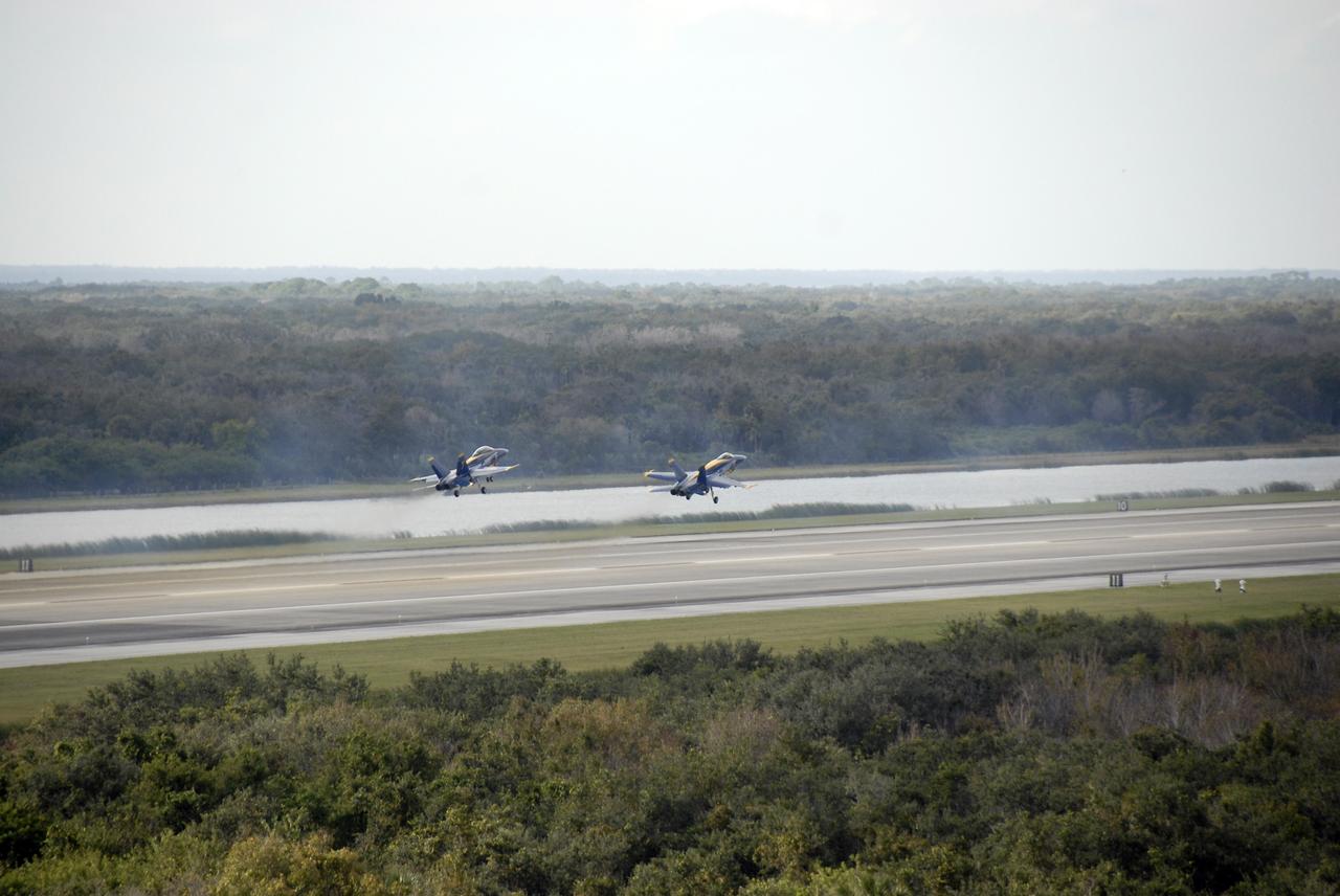 CAPE CANAVERAL, Fla. –  The U.S. Navy's F/A-18 Blue Angels take off from the runway at the Shuttle Landing Facility at NASA's Kennedy Space Center in Florida to begin rehearsing their demonstrations for the Kennedy Space Center Visitor Complex Space and Air Show Nov. 8-9.   The Navy's elite flight demonstration squadron will take to the skies in military aircraft demonstrations for the second annual Space & Air Show at Kennedy. This year’s show brings together the best in military aircraft, coupled with precision pilots and veteran astronauts to celebrate spaceflight and aviation. The event also includes demonstrations by the F-16 Fighting Falcon and a water rescue demonstration by the 920th Rescue Wing.  Photo credit: NASA/Kim Shiflett