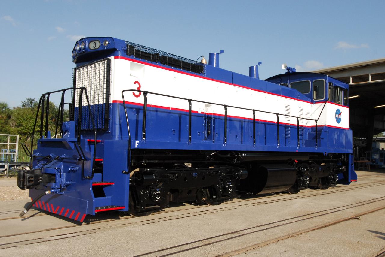 CAPE CANAVERAL, Fla. –    At NASA's Kennedy Space Center in Florida, NASA Railroad locomotive 3 has been repainted. The Railroad Operation and Maintenance Team at Kennedy completed the refurbishment of locomotive 3 in October. The 15-month process, including a new paint scheme, dealt with extensive corrosion to the locomotive because of Kennedy's proximity to the Atlantic Ocean.  Locomotives 1 and 2 also will be refurbished eventually.  The NASA Railroad locomotives are SW-1500 switch engines built by Electro Motive Diesel (EMD).  Photo credit:  NASA/Amanda Diller