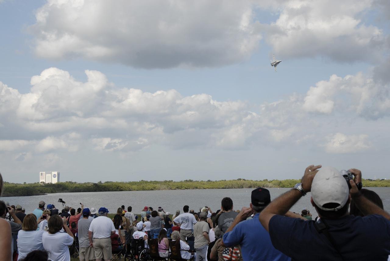 CAPE CANAVERAL, Fla. –   Crowds on the banks of the Banana River at NASA's Kennedy Space Center in Florida watch as an F/A-18 Super Hornet jet  shows its maneuvers.  The Super Hornet was part of the Kennedy Space Center Visitor Complex Space and Air Show Nov. 8-9.  This year’s show brought together the best in military aircraft, such as the F/A-18 Super Hornet and F-16 Fighting Falcon, coupled with precision pilots and veteran astronauts to celebrate spaceflight and aviation. The event included a water rescue demonstration by the 920th Rescue Wing.  Photo credit: NASA/Kim Shiflett