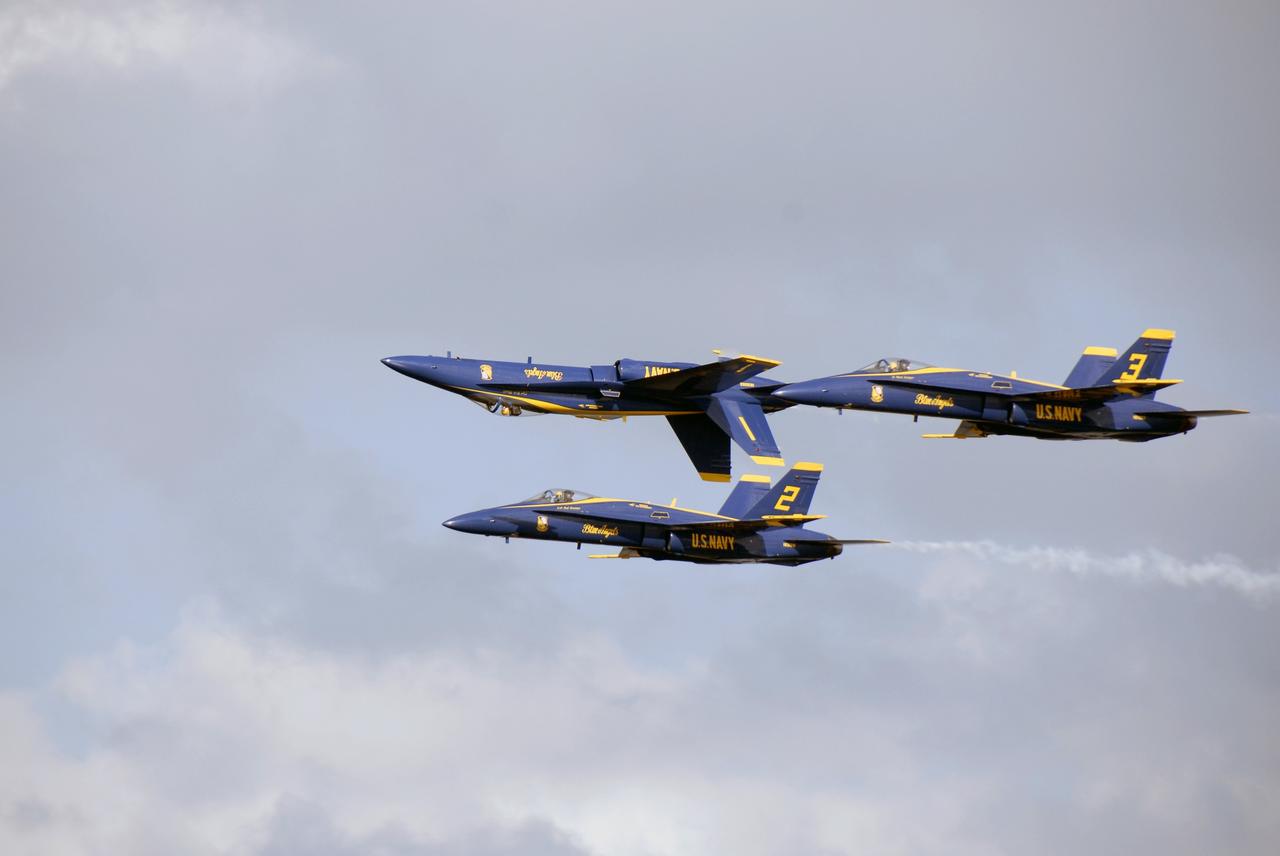 CAPE CANAVERAL, Fla. –  The U.S. Navy's Blue Angels perform their tight maneuvers over NASA's Kennedy Space Center in Florida during the Kennedy Space Center Visitor Complex Space and Air Show Nov. 8-9.  This year’s show brought together the best in military aircraft, such as the F/A-18 Super Hornet and F-16 Fighting Falcon, coupled with precision pilots and veteran astronauts to celebrate spaceflight and aviation. The event included a water rescue demonstration by the 920th Rescue Wing.  Photo credit: NASA/Kim Shiflett