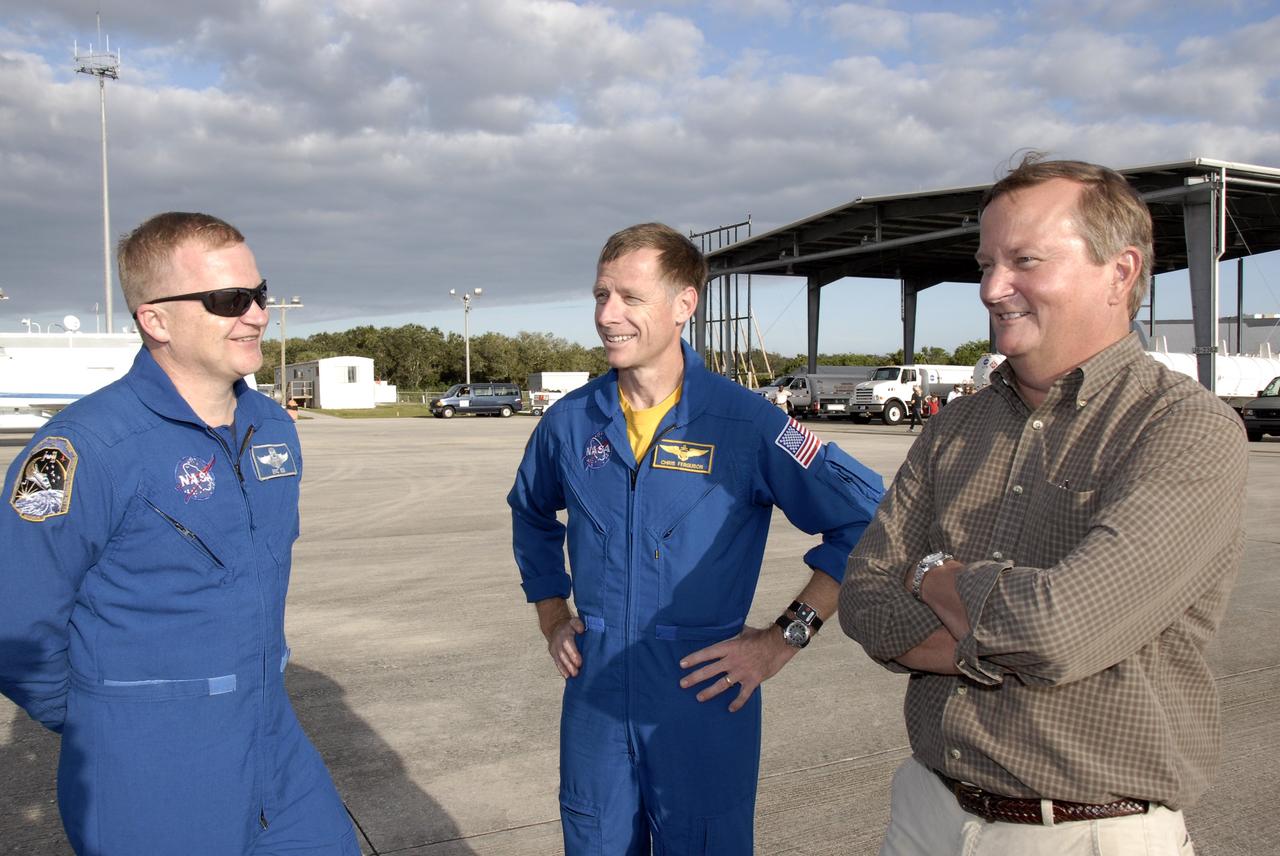 CAPE CANAVERAL, Fla. –   The crew members for the STS-126 mission arrive at NASA's Kennedy Space Center in Florida to prepare for launch.  Pilot Eric Boe (left) and Commander Chris Ferguson (center) are welcomed by Shuttle Launch Director Mike Leinbach. STS-126 is the 124th space shuttle flight and the 27th flight to the International Space Station. The mission will feature four spacewalks and important repair work and will prepare the space station to house six crew members for long- duration missions.  Liftoff is scheduled for 7:55 p.m. EST Nov. 14. Photo credit: NASA/Kim Shiflett