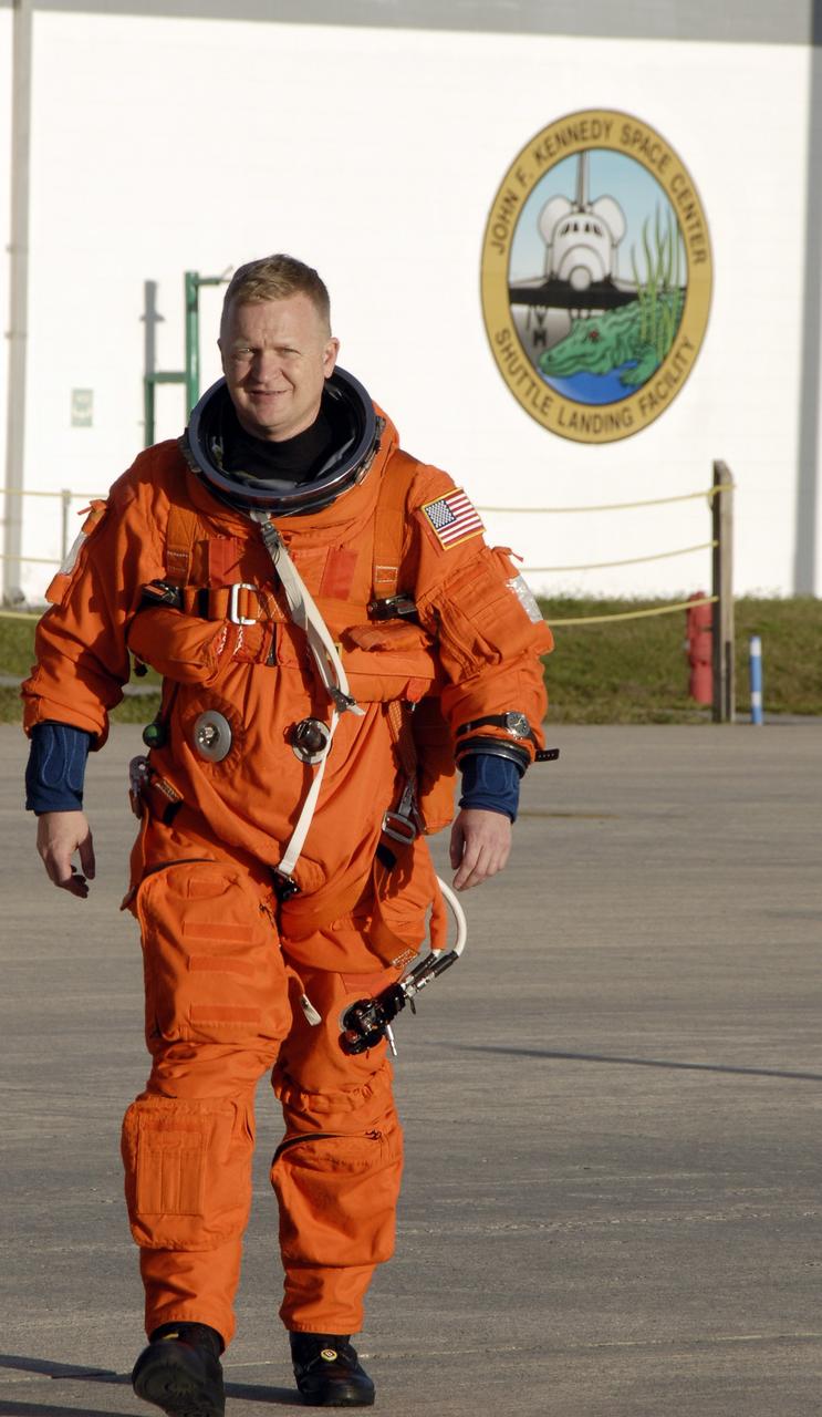 CAPE CANAVERAL, Fla. –  STS-126 Pilot Eric Boe, wearing his launch-and-entry suit, heads for the Shuttle Training Aircraft to practice shuttle landings on the Shuttle Landing Facility's runway at NASA's Kennedy Space Center in Florida.  The mission crew members arrived at Kennedy to prepare for launch.  STS-126 is the 124th space shuttle flight and the 27th flight to the International Space Station. The 15-day mission will feature four spacewalks and work that will prepare the space station to house six crew members for long- duration missions.  Liftoff is scheduled for 7:55 p.m. EST Nov. 14.  Photo credit: NASA/Kim Shiflett