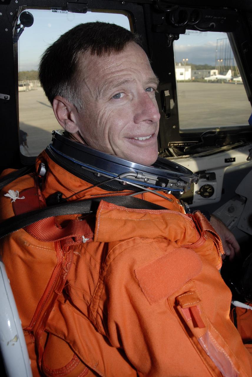 CAPE CANAVERAL, Fla. – Wearing his launch-and-entry suit, STS-126 Commander Chris Ferguson is seated in the Shuttle Training Aircraft to practice shuttle landings on the Shuttle Landing Facility's runway at NASA's Kennedy Space Center in Florida. The mission crew members arrived at Kennedy to prepare for launch. STS-126 is the 124th space shuttle flight and the 27th flight to the International Space Station. The 15-day mission will feature four spacewalks and work that will prepare the space station to house six crew members for long- duration missions. Liftoff is scheduled for 7:55 p.m. EST Nov. 14. Photo credit: NASA/Kim Shiflett