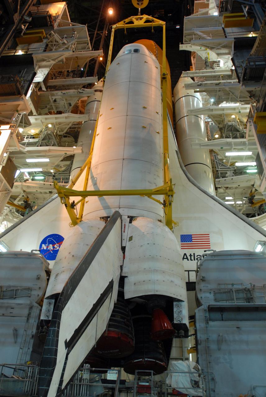 CAPE CANAVERAL, Fla. –   In the Vehicle Assembly Building at NASA's Kennedy Space Center in Florida, space shuttle Atlantis is lifted by a sling.  Atlantis is being taken off its external fuel tank and solid rocket boosters stack after of the delay of its STS-125 mission to NASA's Hubble Space Telescope.  Atlantis will be returned to the Orbiter Processing Facility. Atlantis' targeted launch on Oct. 14 was delayed when a system that transfers science data from the orbiting observatory to Earth malfunctioned on Sept. 27. The new target launch date is under review. Photo credit: NASA/Jim Grossmann