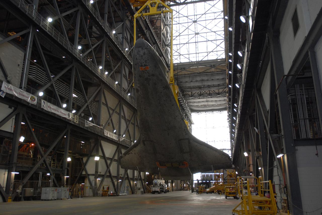 CAPE CANAVERAL, Fla. –  In the transfer aisle of the Vehicle Assembly Building at NASA's Kennedy Space Center in Florida, space shuttle Atlantis is lowered to a horizontal position.  Atlantis has been taken off its external fuel tank and solid rocket boosters stack after of the delay of its STS-125 mission to NASA's Hubble Space Telescope.  Atlantis will be returned to the Orbiter Processing Facility. Atlantis' targeted launch on Oct. 14 was delayed when a system that transfers science data from the orbiting observatory to Earth malfunctioned on Sept. 27. The new target launch date is under review. Photo credit: NASA/Jim Grossmann