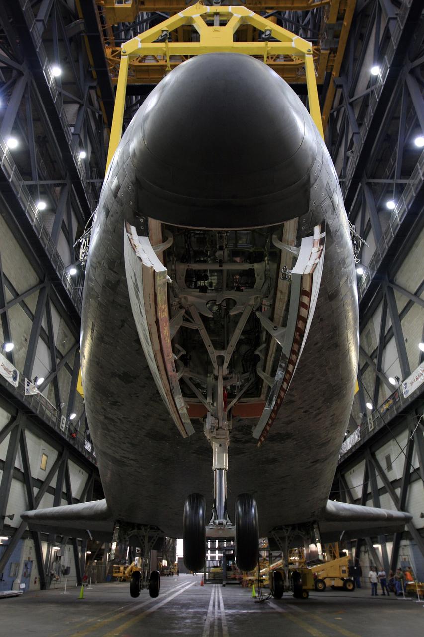 CAPE CANAVERAL, Fla. –  This close-up shows space shuttle Atlantis being lowered onto its wheels in the transfer aisle of the Vehicle Assembly Building at NASA's Kennedy Space Center in Florida. Atlantis has been removed from its external fuel tank and solid rocket boosters stack after the delay of its STS-125 mission to NASA's Hubble Space Telescope.  Atlantis will be returned to the Orbiter Processing Facility. Atlantis' targeted launch on Oct. 14 was delayed when a system that transfers science data from the orbiting observatory to Earth malfunctioned on Sept. 27. The new target launch date is under review. Photo credit: NASA/Troy Cryder