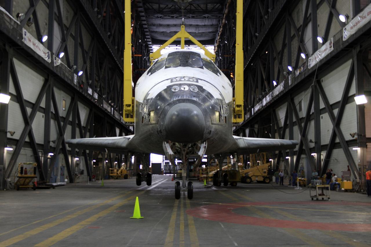 CAPE CANAVERAL, Fla. –  This close-up shows space shuttle Atlantis being lowered onto its wheels in the transfer aisle of the Vehicle Assembly Building at NASA's Kennedy Space Center in Florida. Atlantis has been removed from its external fuel tank and solid rocket boosters stack after the delay of its STS-125 mission to NASA's Hubble Space Telescope.  Atlantis will be returned to the Orbiter Processing Facility. Atlantis' targeted launch on Oct. 14 was delayed when a system that transfers science data from the orbiting observatory to Earth malfunctioned on Sept. 27. The new target launch date is under review. Photo credit: NASA/Troy Cryder