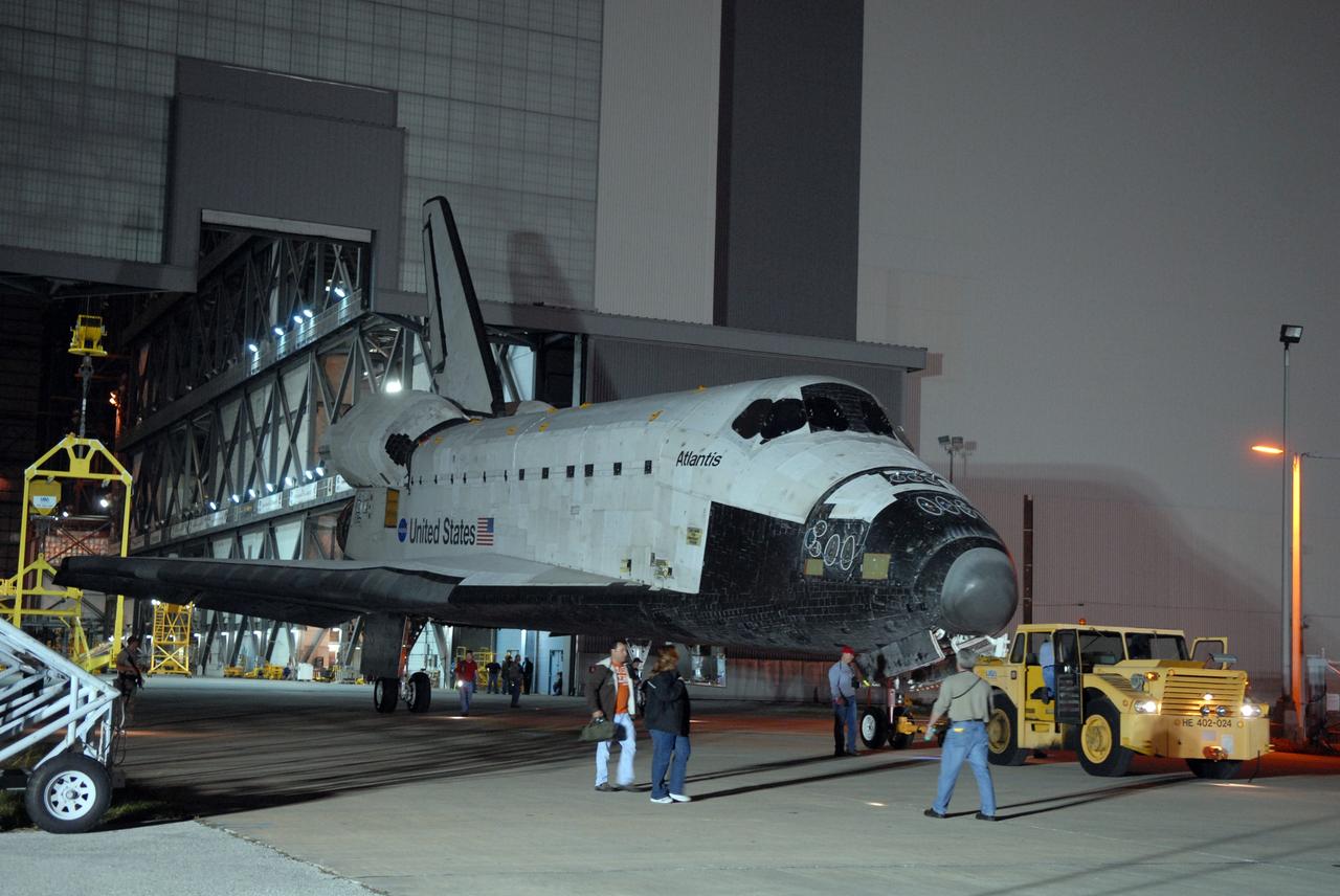 CAPE CANAVERAL, Fla. –  Space shuttle Atlantis is towed out of the Vehicle Assembly Building at NASA's Kennedy Space Center in Florida.  Atlantis was removed from its external fuel tank and solid rocket boosters stack after the delay of its STS-125 mission to NASA's Hubble Space Telescope.  It is returning to the Orbiter Processing Facility. Atlantis' targeted launch on Oct. 14 was delayed when a system that transfers science data from the orbiting observatory to Earth malfunctioned on Sept. 27. The new target launch date is under review. Photo credit: NASA/Tim Jacobs