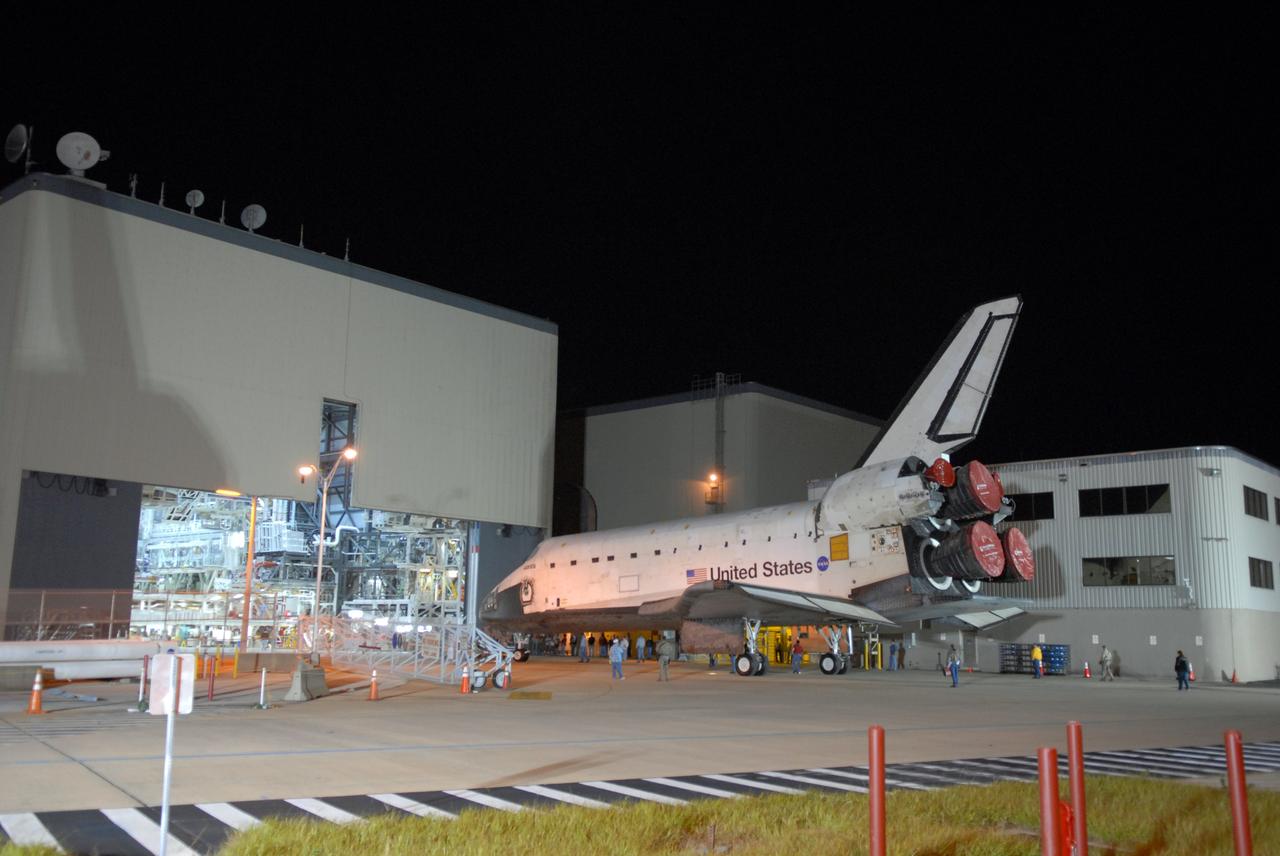 CAPE CANAVERAL, Fla. –  Space shuttle Atlantis is towed into the Orbiter Processing Facility.  Atlantis was removed from its external fuel tank and solid rocket boosters stack in the Vehicle Assembly Building after the delay of its STS-125 mission to NASA's Hubble Space Telescope. Atlantis' targeted launch on Oct. 14 was delayed when a system that transfers science data from the orbiting observatory to Earth malfunctioned on Sept. 27. The new target launch date is under review. Photo credit: NASA/Tim Jacobs