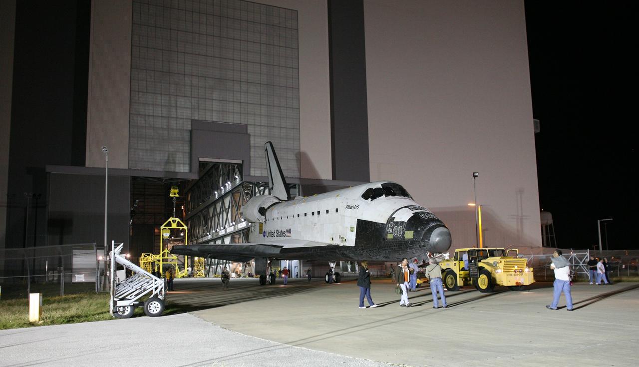 CAPE CANAVERAL, Fla. –  Space shuttle Atlantis is towed out of the Vehicle Assembly Building at NASA's Kennedy Space Center in Florida.  Atlantis was removed from its external fuel tank and solid rocket boosters stack after the delay of its STS-125 mission to NASA's Hubble Space Telescope.  It is returning to the Orbiter Processing Facility. Atlantis' targeted launch on Oct. 14 was delayed when a system that transfers science data from the orbiting observatory to Earth malfunctioned on Sept. 27. The new target launch date is under review. Photo credit: NASA/Dimitri Gerondidakis