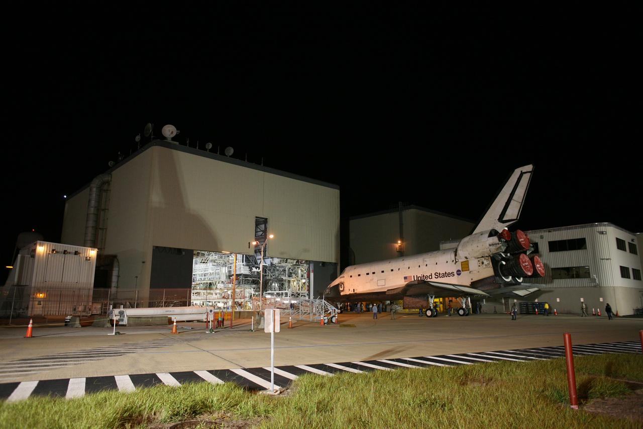 CAPE CANAVERAL, Fla. –  Space shuttle Atlantis is towed into the Orbiter Processing Facility.  Atlantis was removed from its external fuel tank and solid rocket boosters stack in the Vehicle Assembly Building after the delay of its STS-125 mission to NASA's Hubble Space Telescope. Atlantis' targeted launch on Oct. 14 was delayed when a system that transfers science data from the orbiting observatory to Earth malfunctioned on Sept. 27. The new target launch date is under review. Photo credit: NASA/Dimitri Gerondidakis
