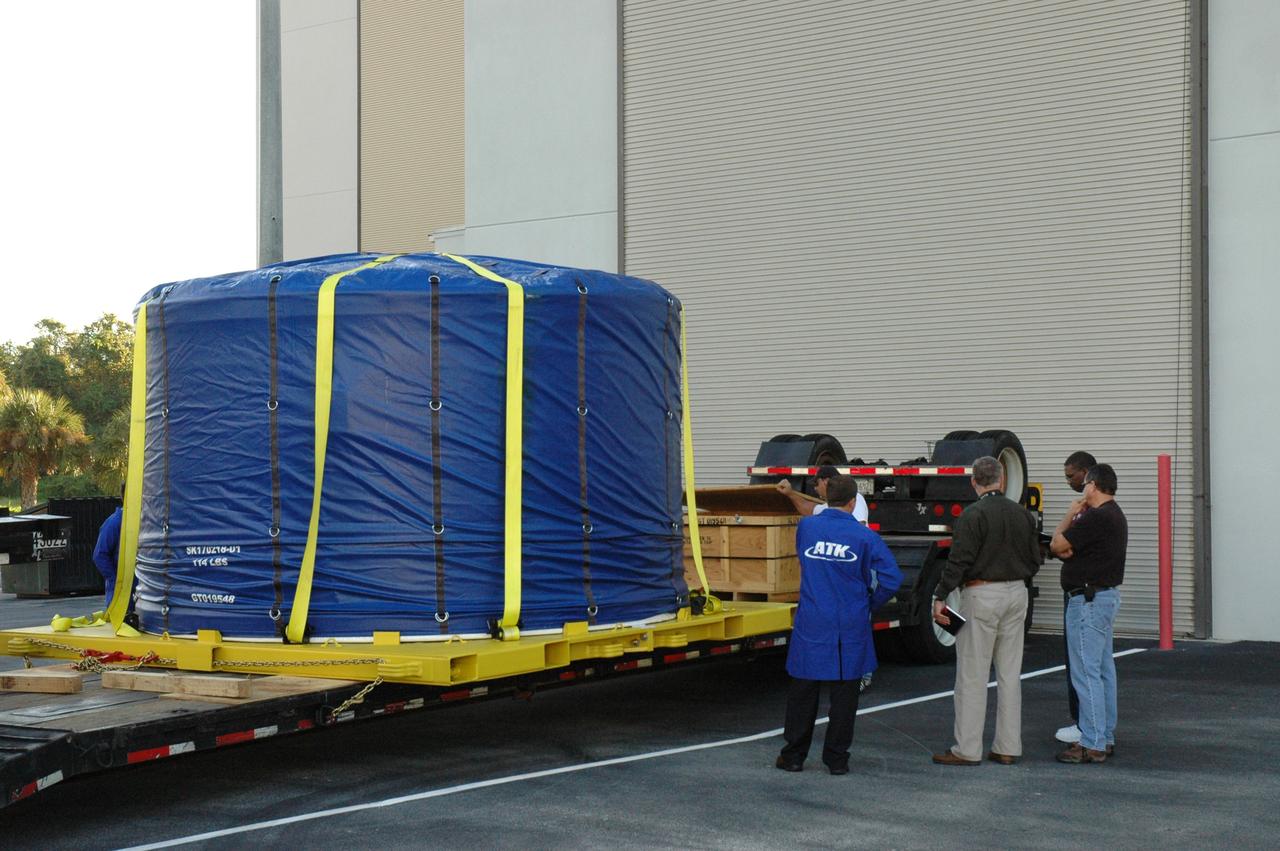 CAPE CANAVERAL, Fla. – The Ares I-X forward skirt arrives at the Astrotech facility in Titusville, Fla., after its journey from Major Tool & Machine Inc. in Indiana. Major Tool is subcontractor to Ares I prime contractor Alliant Techsystems Inc., or ATK, in Utah. The forward skirt is the initial piece of first-stage hardware in preparation for the July 2009 test flight of the agency's next-generation spacecraft and launch vehicle system. Built entirely of armored steel, the 14,000-pound segment is seven feet tall and 12-1/4 feet wide. United Space Alliance, under a subcontract to ATK, will integrate and assemble the forward skirt components in the Assembly and Refurbishment Facility at NASA's Kennedy Space Center in Florida.. It will then be moved to the Vehicle Assembly Building high bay 3 for stacking operations. Photo credit: NASA/Tim Jacobs