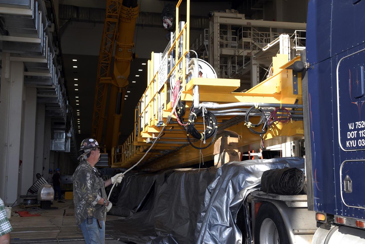 CAPE CANAVERAL, Fla. – Segments of a crane arrive at the Operations and Checkout Building at NASA's Kennedy Space Center in Florida. The new O&C low-bay crane is a 25-ton overhead bridge crane built for Lockheed Martin and Space Florida by American Crane and Equipment Corporation in Douglasville, Pa. The crane has a bridge span of 78’-2” and a hook height of 48’-10”. The crane will be used for lifting and moving flight hardware, fixtures and equipment in support of the Orion spacecraft manufacturing. Part of NASA's Constellation Program, the Orion spacecraft will return humans to the moon and prepare for future voyages to Mars and other destinations in our solar system. Photo credit: NASA/Kim Shiflett